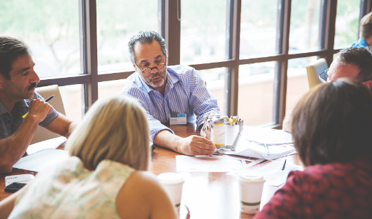 Dentist presenting to a group